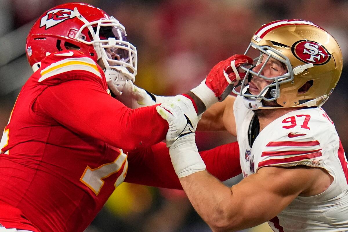 Kansas City Chiefs offensive tackle Jawaan Taylor, left, and San Francisco 49ers defensive end ...