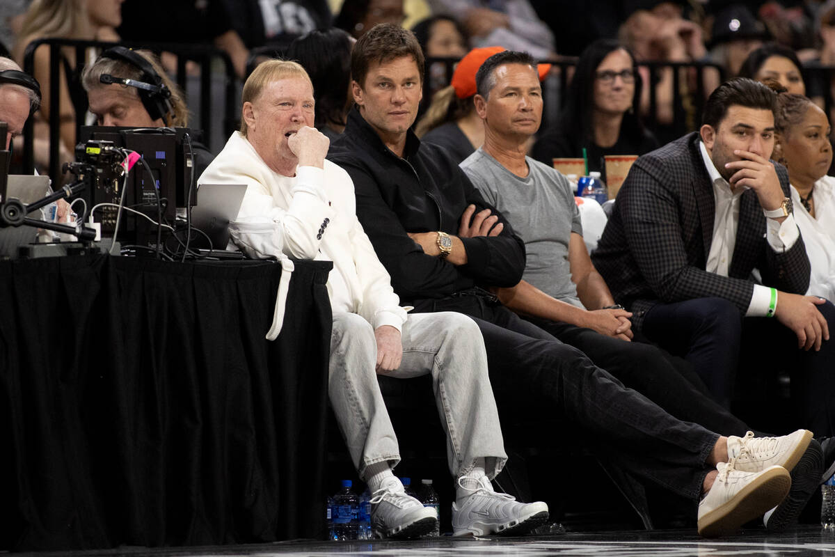 Las Vegas Aces owner Mark Davis, center left, sits next to NFL superstar Tom Brady during the f ...
