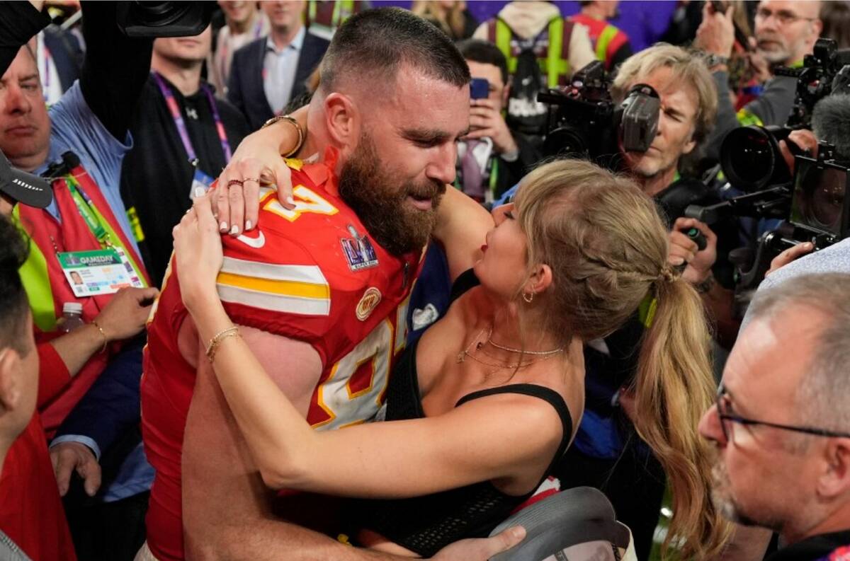 Kansas City Chiefs tight end Travis Kelce (87) embraces Taylor Swift after the NFL Super Bowl 5 ...