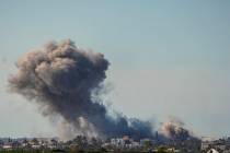 Smoke and explosion following an Israeli bombardment inside the Gaza Strip, as seen from southe ...