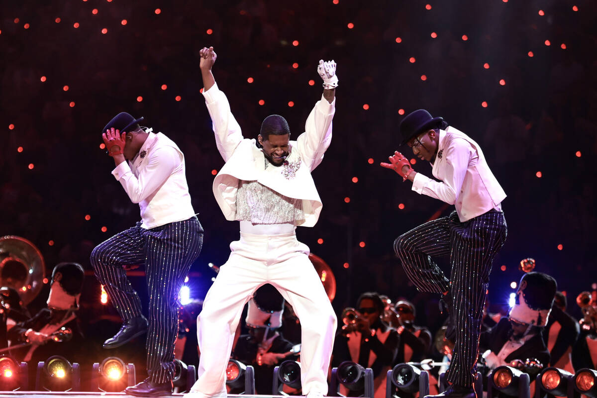 Usher performs during halftime of Super Bowl 58 Sunday, February 11, 2024, at Allegiant Stadiu ...