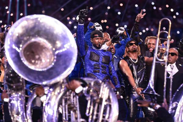 Usher performs during halftime of Super Bowl 58 Sunday, February 11, 2024, at Allegiant Stadiu ...