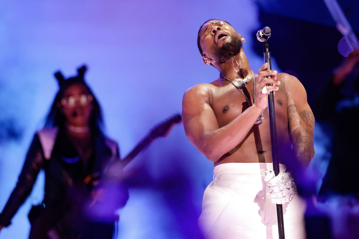 Usher performs during halftime of Super Bowl 58 Sunday, February 11, 2024, at Allegiant Stadiu ...