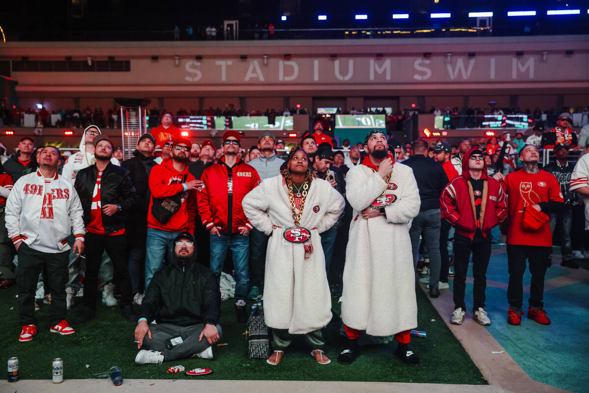 Guests watch the Kansas City Chiefs face off the San Francisco 49ers for Super Bowl LVIII at Ci ...