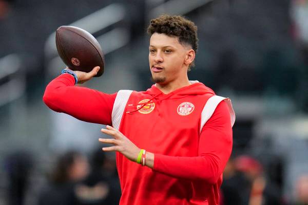 Kansas City Chiefs quarterback Patrick Mahomes warms up before the NFL Super Bowl 58 football g ...