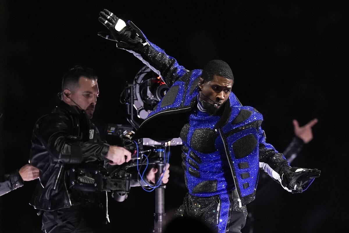 Usher performs during halftime of the NFL Super Bowl 58 football game between the San Francisco ...