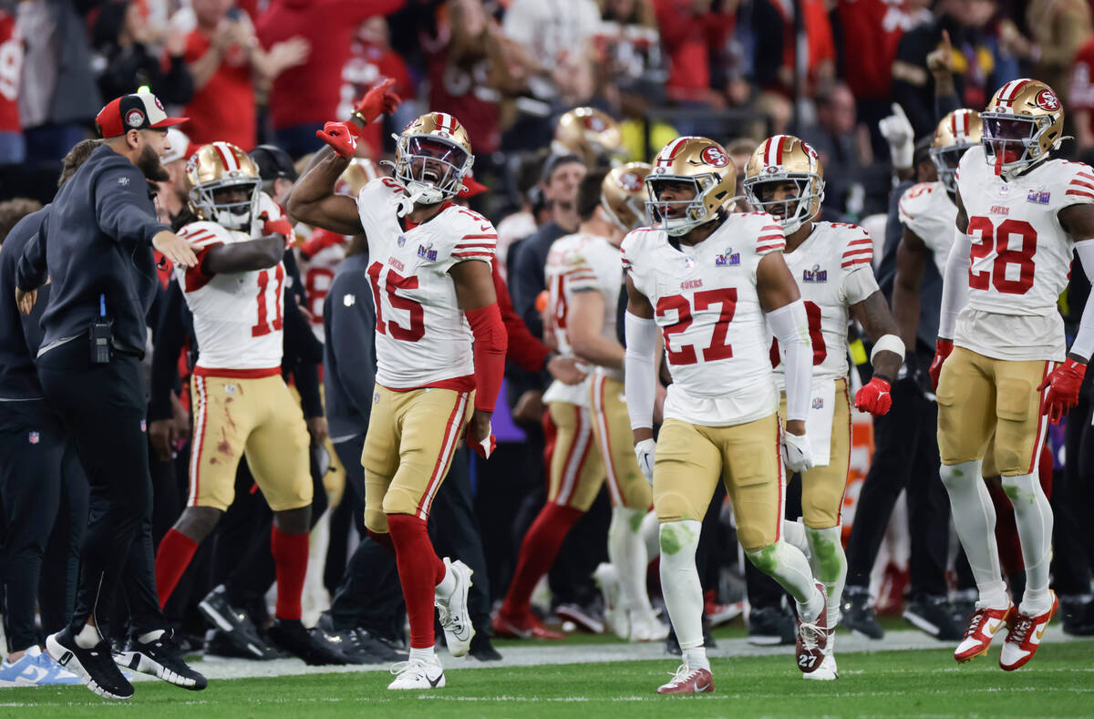 The San Francisco 49ers, including wide receiver Jauan Jennings (15), celebrate an interception ...
