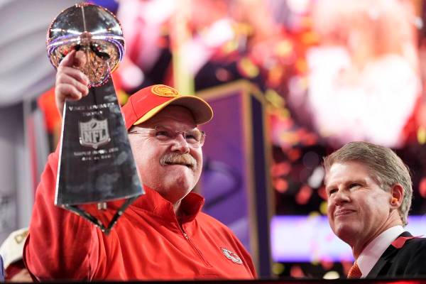 Kansas City Chiefs head coach Andy Reid holds the Vince Lombardi Trophy as Kansas City Chiefs c ...