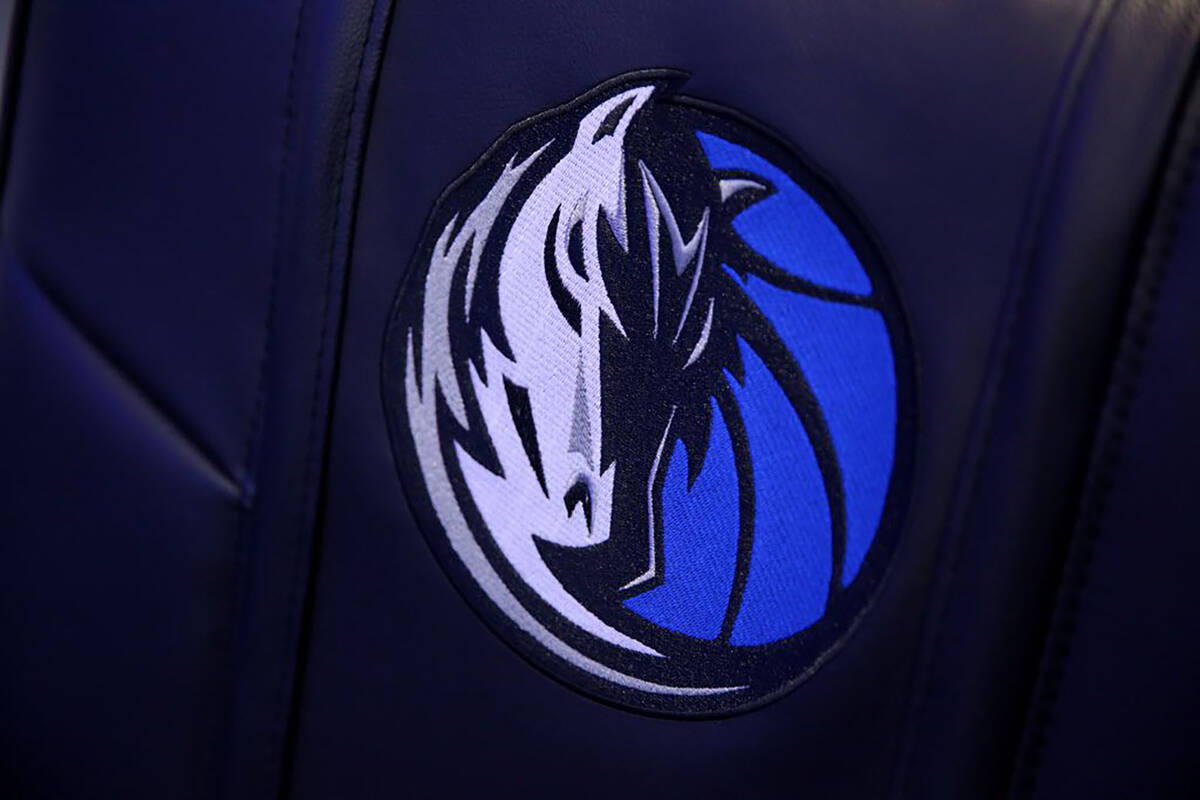 The Dallas Mavericks logo is printed on a chair inside the team's locker room at the American A ...