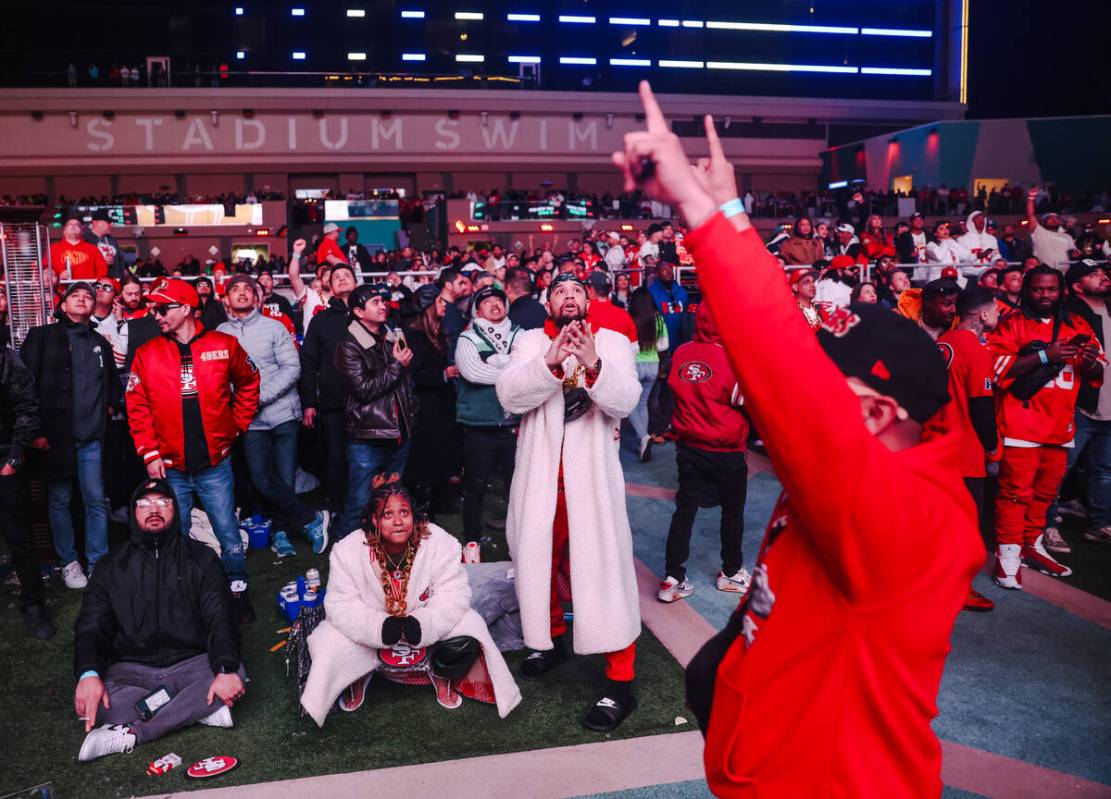 Guests watch the Kansas City Chiefs face off the San Francisco 49ers for Super Bowl LVIII at Ci ...