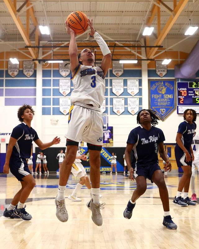 Sierra Vista guard Khamari Taylor (3) shoots against Shadow Ridge during a Class 4A first round ...