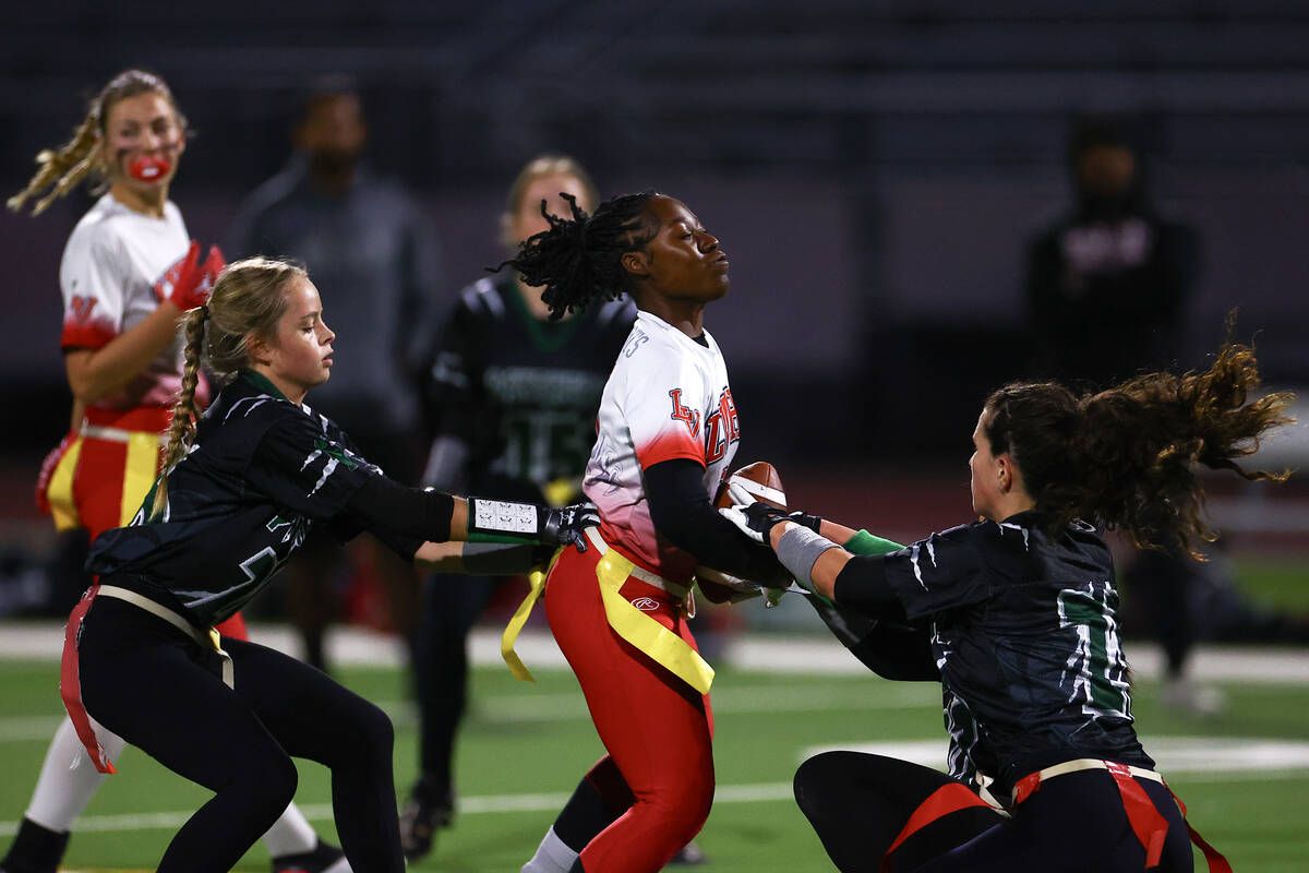 Palo Verde’s Samantha Manzo (26) and Olivia Perkins (25) take the flag of Las Vegas&#x20 ...