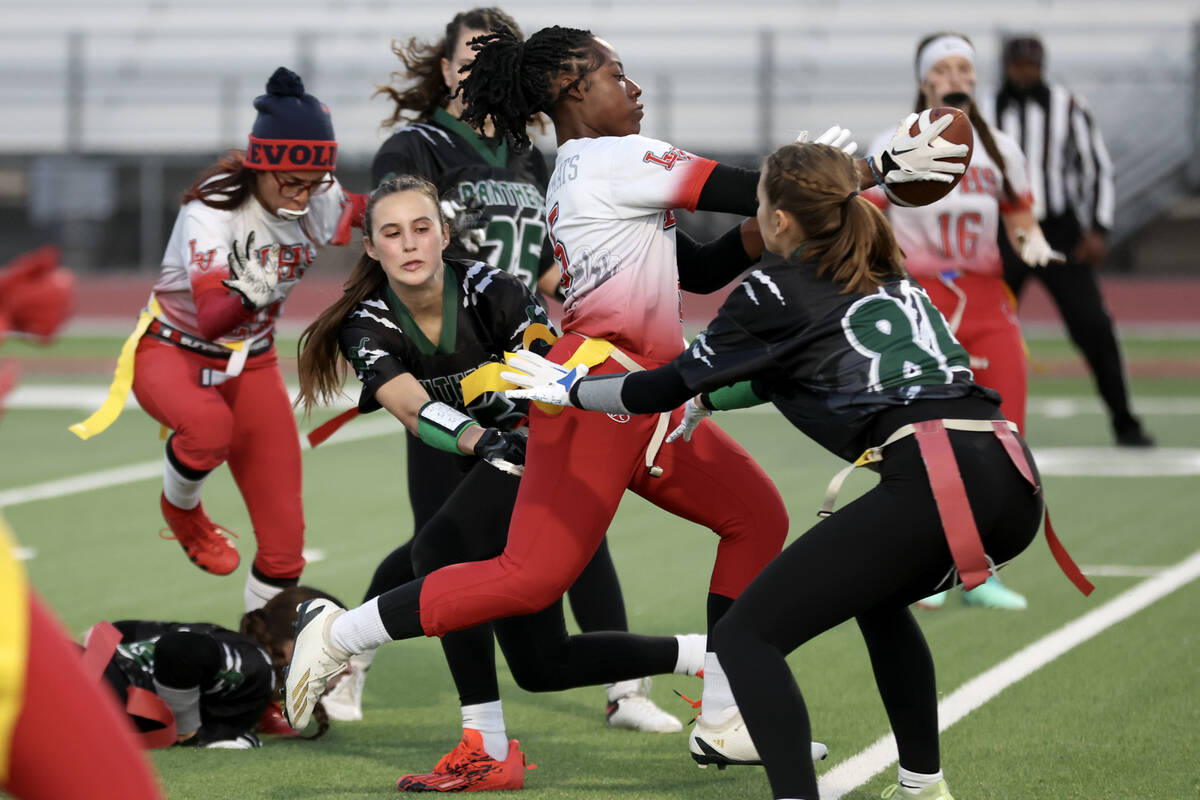 Las Vegas’ Antonia Pierce (5) runs the ball but is thwarted by Palo Verde’s Tia B ...