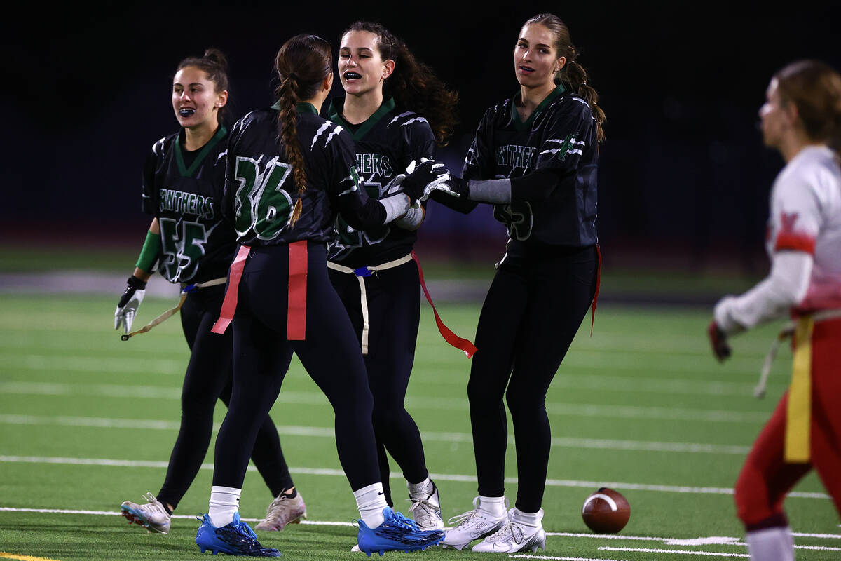 Palo Verde congratulates their Olivia Perkins (25) after she ended a Las Vegas offensive run du ...