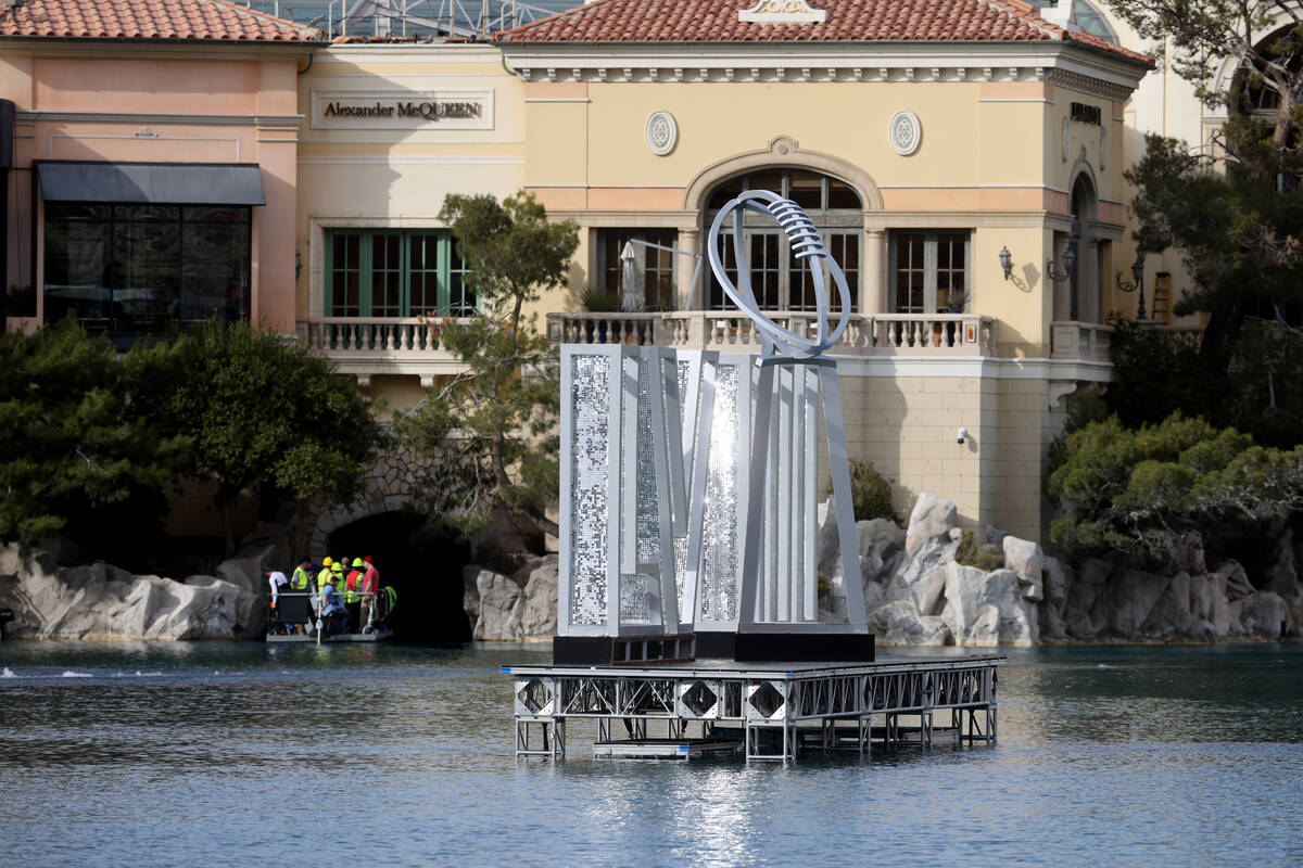 Crews tear down setups from the 2024 Super Bowl at the Bellagio Fountains on the Strip in Las V ...