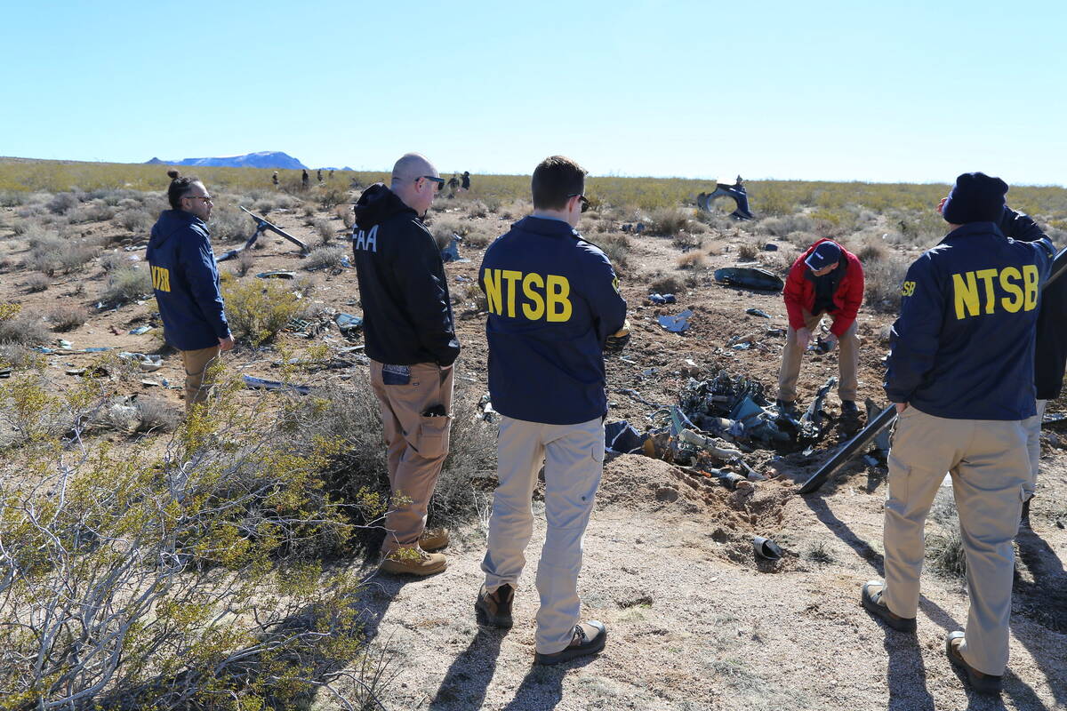 NTSB investigators at the site of the Feb. 9, 2024, crash of an Airbus Helicopters EC-130 near ...