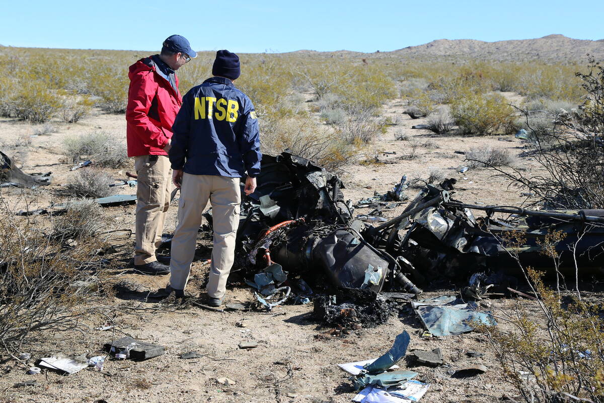 NTSB investigators at the site of the Feb. 9, 2024, crash of an Airbus Helicopters EC-130 near ...