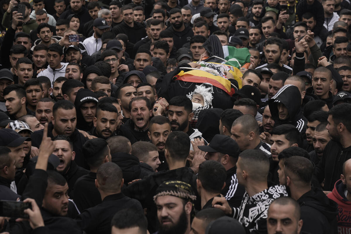 Palestinians attend the funeral of Mohammed Sherif Hassan Selmi in Qalqiliya, West Bank, Tuesda ...