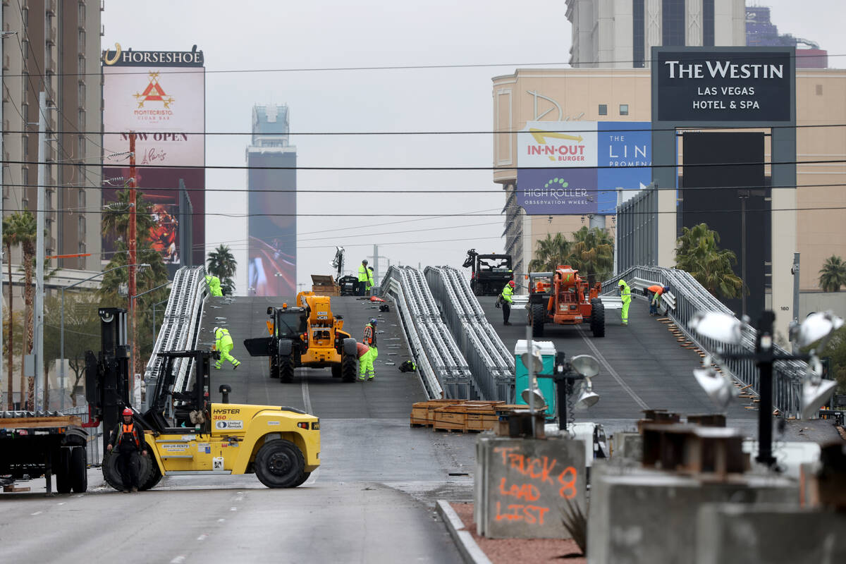 Crews remove a temporary Las Vegas Grand Prix bridge on Flamingo Road over Koval Lane Monday, J ...