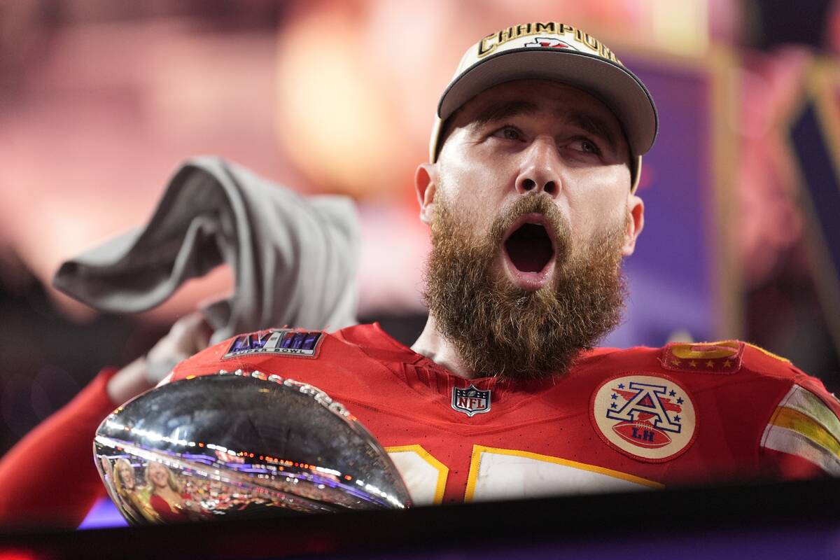 Kansas City Chiefs tight end Travis Kelce (87) celebrates while holding the Vince Lombardi Trop ...
