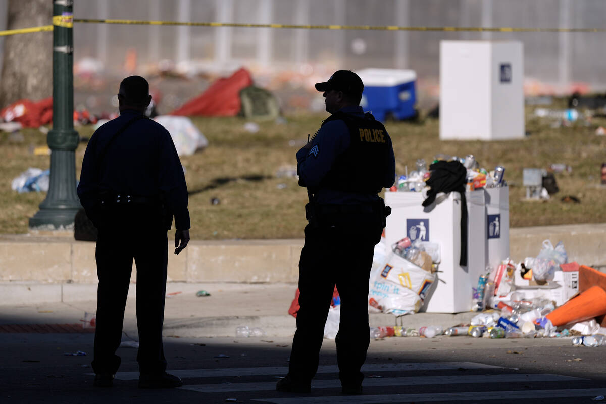 Law enforcement officers look around the scene after an incident following the Kansas City Chie ...