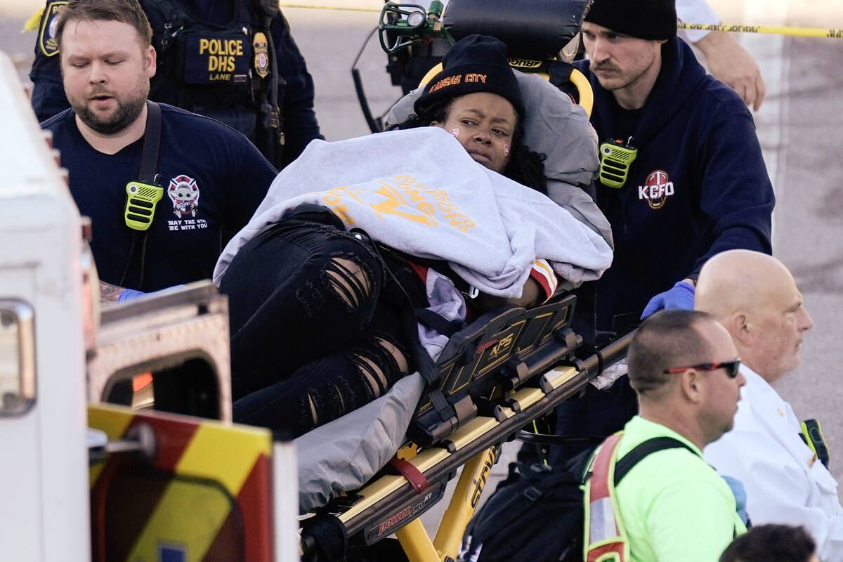 A person is taken to an ambulance following a shooting at the Kansas City Chiefs NFL football S ...