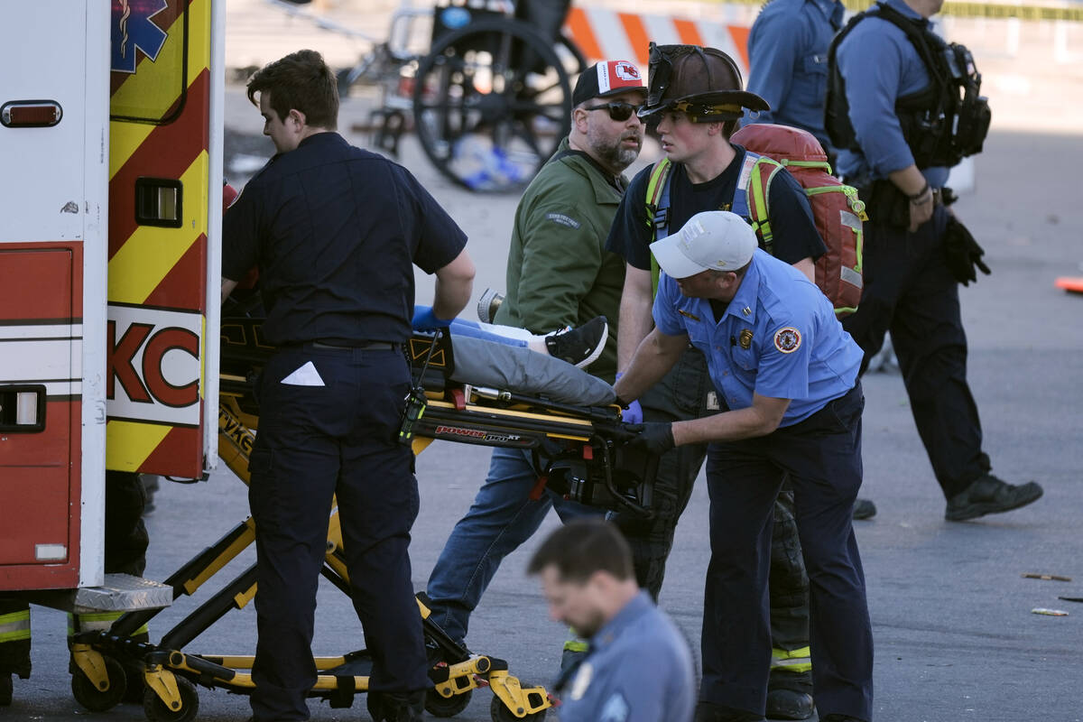 A person is taken to an ambulance after an incident following the Kansas City Chiefs victory pa ...