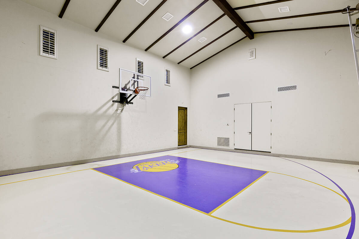 The Southern Highlands home has an indoor basketball court, basement game room, wine cellar and ...