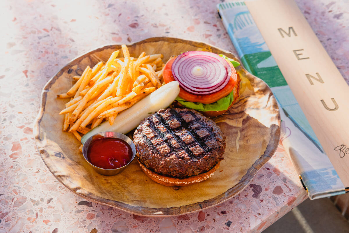 A Poolhouse Burger with classic fixings from Backyard Grill, the bar and restaurant at Bel-Aire ...