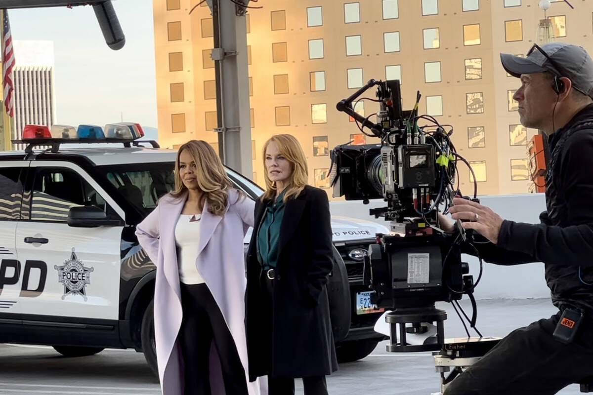 Paula Newsome, left, and Marg Helgenberger film a scene atop Circa's Garage Mahal for the "CSI: ...