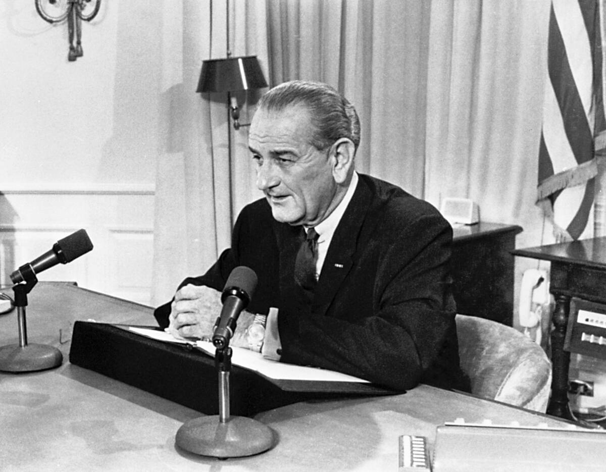 FILE - President Lyndon Johnson tells a nationwide audience that he would not seek nor accept & ...