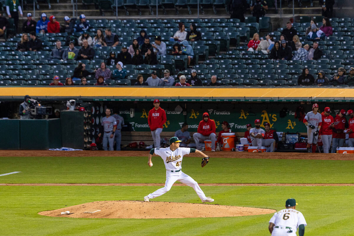 The Oakland Athletics starting pitcher Drew Rucinski delivers against the Cincinnati Reds, on F ...