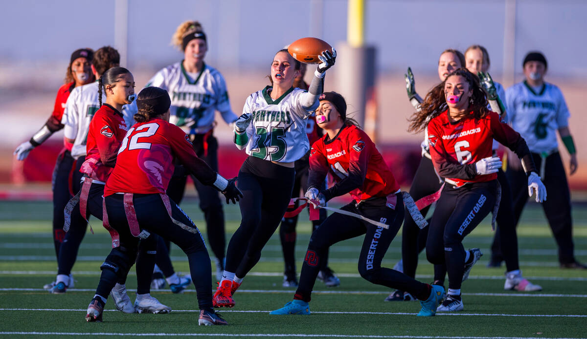 Palo Verde running back Tia Brown (35) has her flag pulled by Desert Oasis defender Aniyah I'i ...