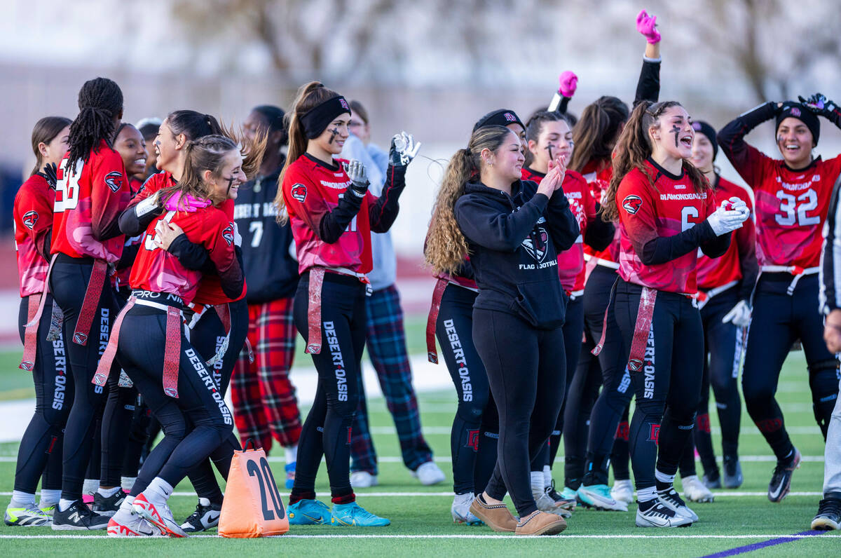 Desert Oasis players celebrate a touchdown over Palo Verde during the first half of their Class ...