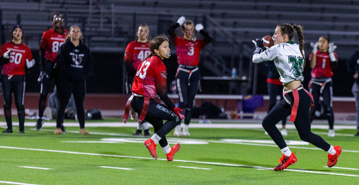 Palo Verde defender Tia Brown (35) intercepts a pass intended for Desert Oasis receiver Erica M ...