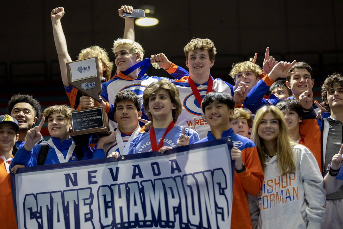 Bishop Gorman celebrates winning the state championship Class 4A championship wrestling meet at ...