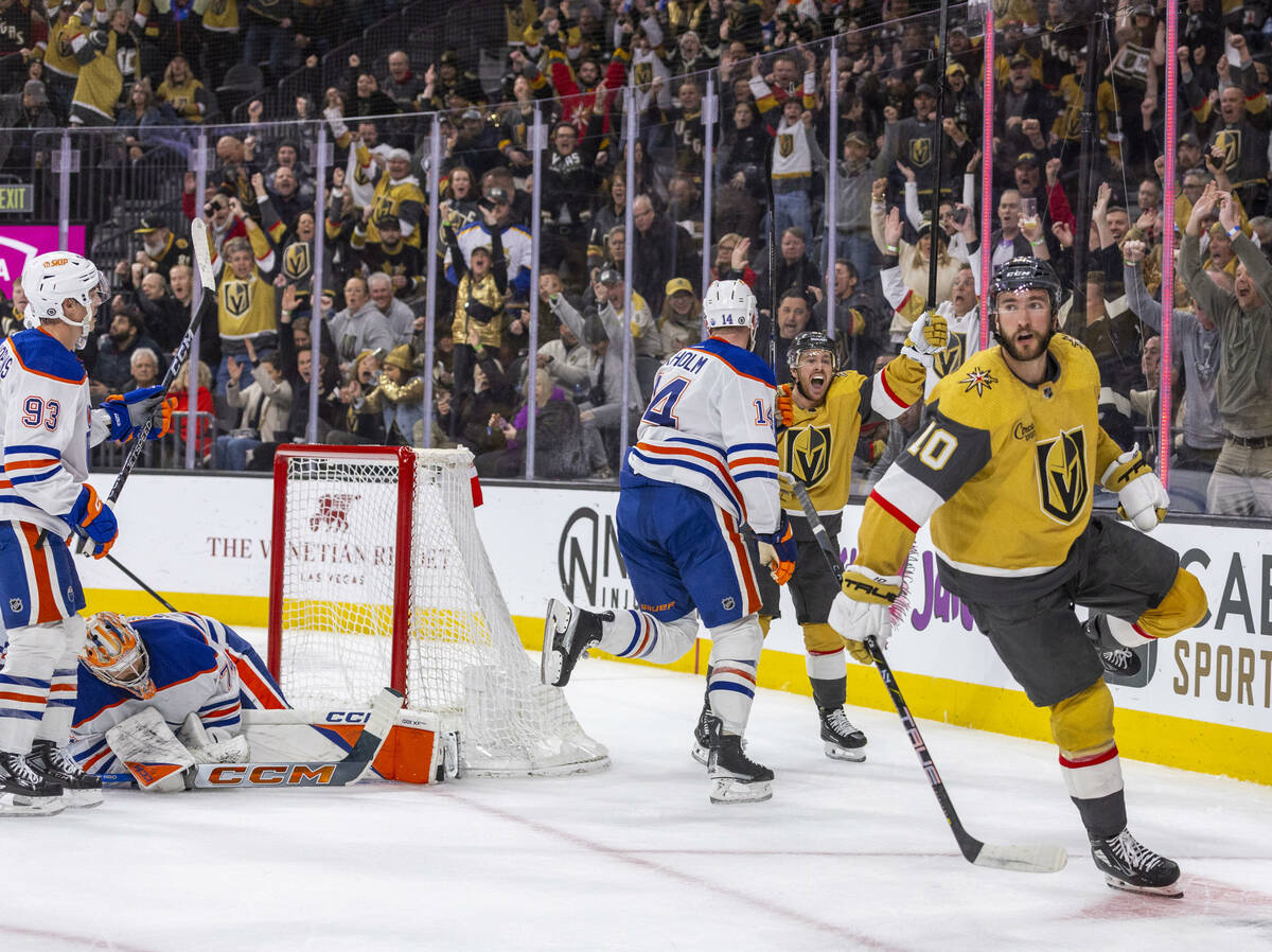 Golden Knights center Nicolas Roy (10) and right wing Jonathan Marchessault (81) celebrate his ...