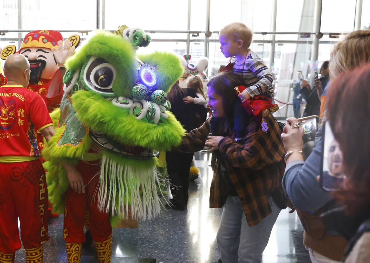 Members of Yau Kung Moon perform the Chinese Dragon and Lion dance to commemorate Lunar New Yea ...