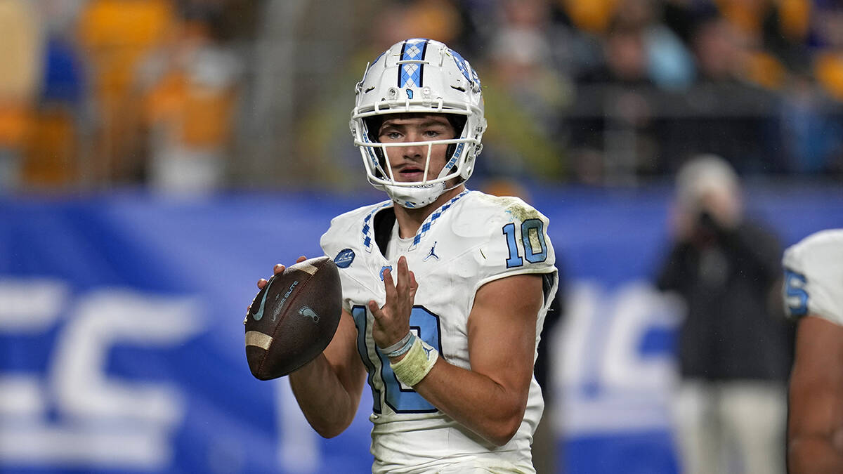 North Carolina quarterback Drake Maye (10) looks to pass during the first half of an NCAA colle ...