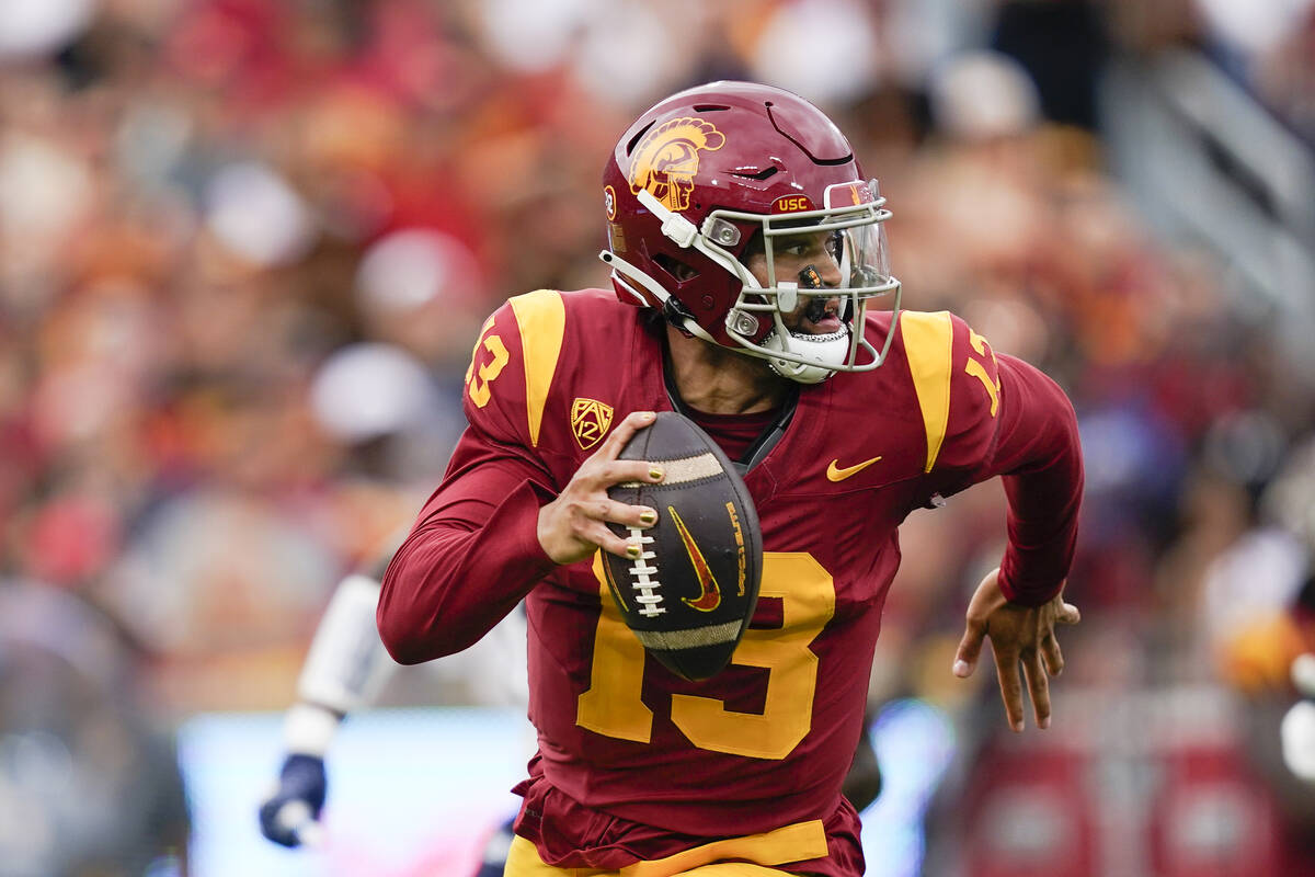 Southern California quarterback Caleb Williams (13) scrambles during the first half of an NCAA ...