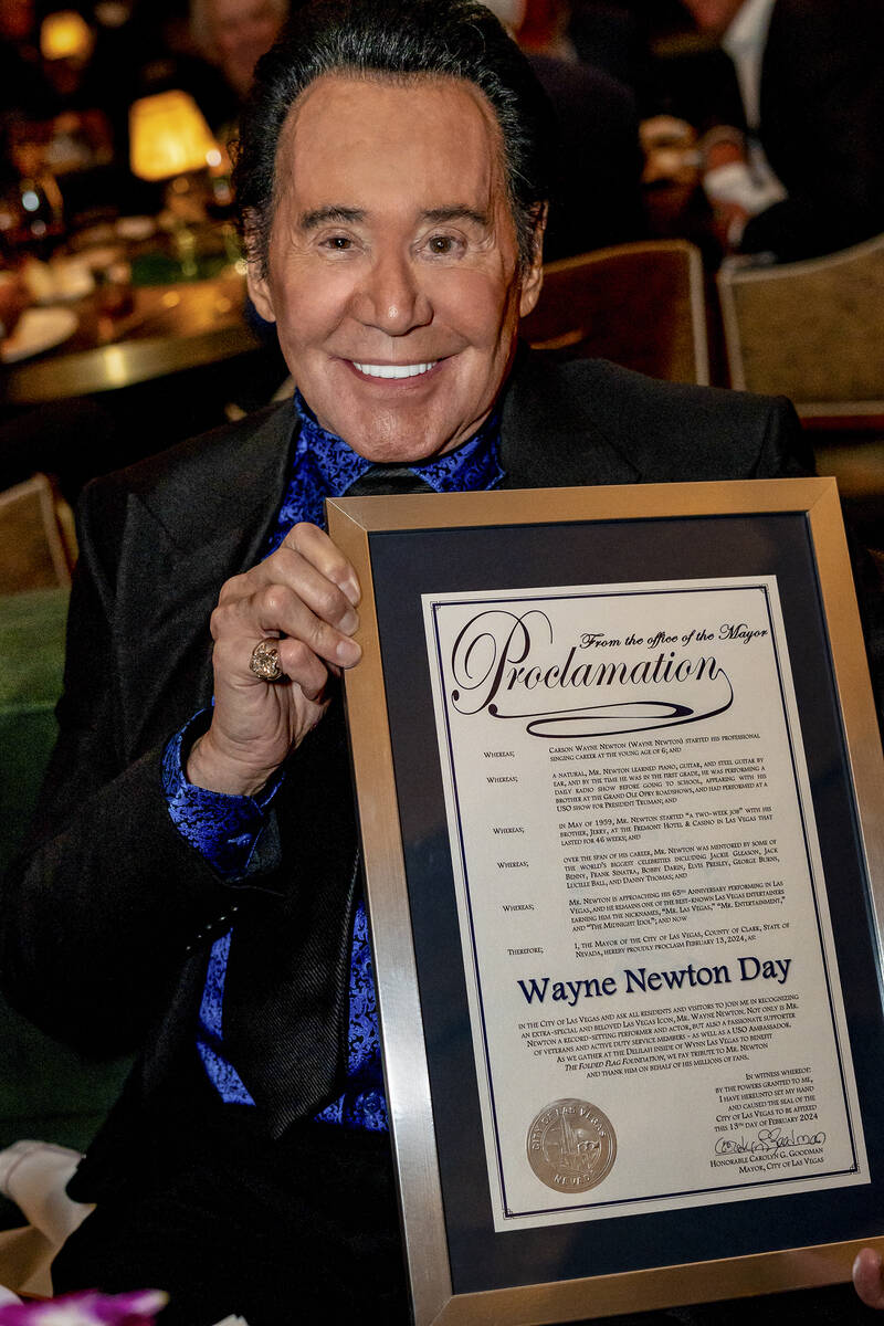 Wayne Newton is shown with a proclamation of Wayne Newton Day on Tuesday, Feb. 13, 2024 at Deli ...