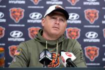 FILE - Chicago Bears offensive coordinator Luke Getsy listens to a question from the media at a ...