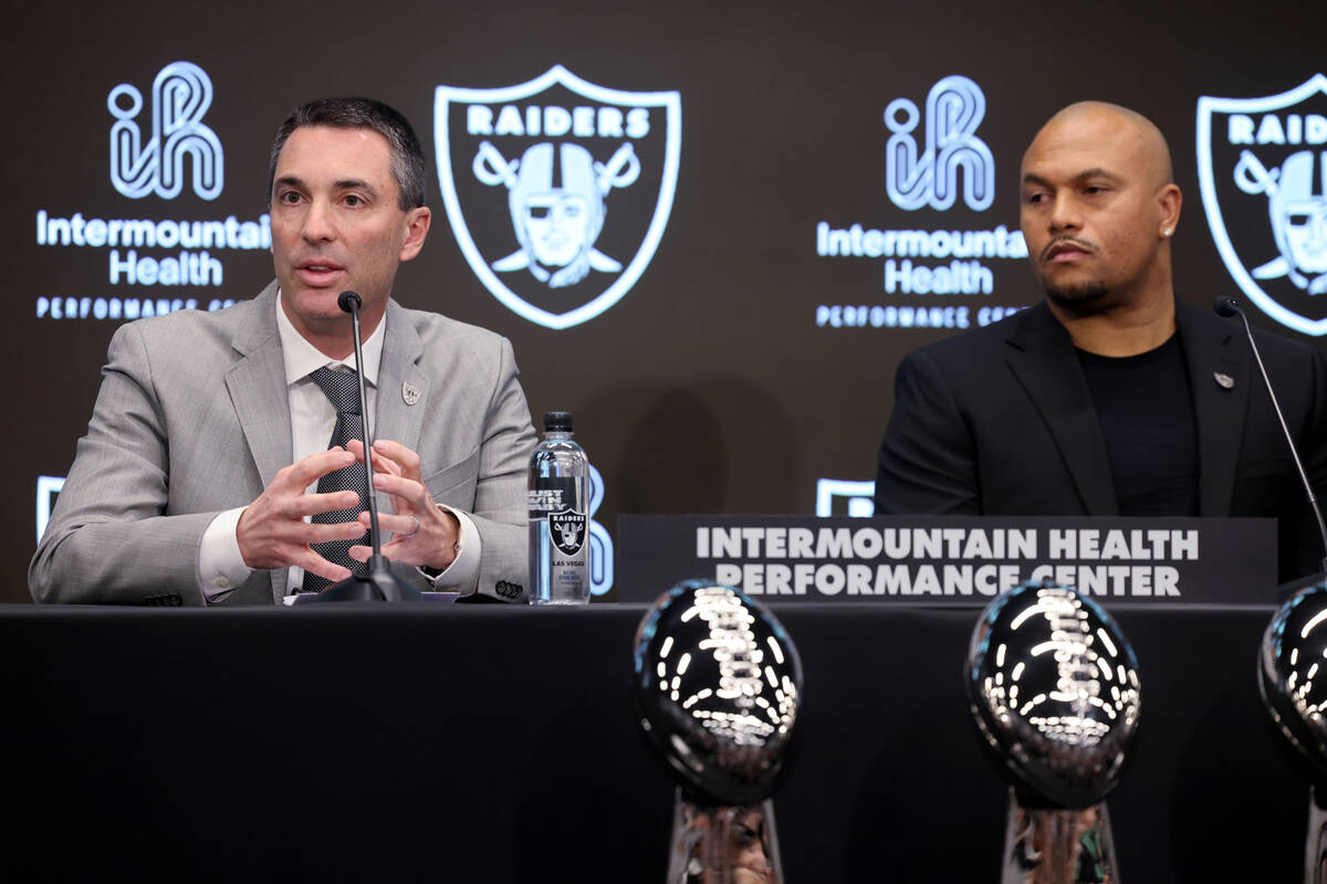 Tom Telesco, left, and Antonio Pierce are introduced as general manager and coach during a pres ...