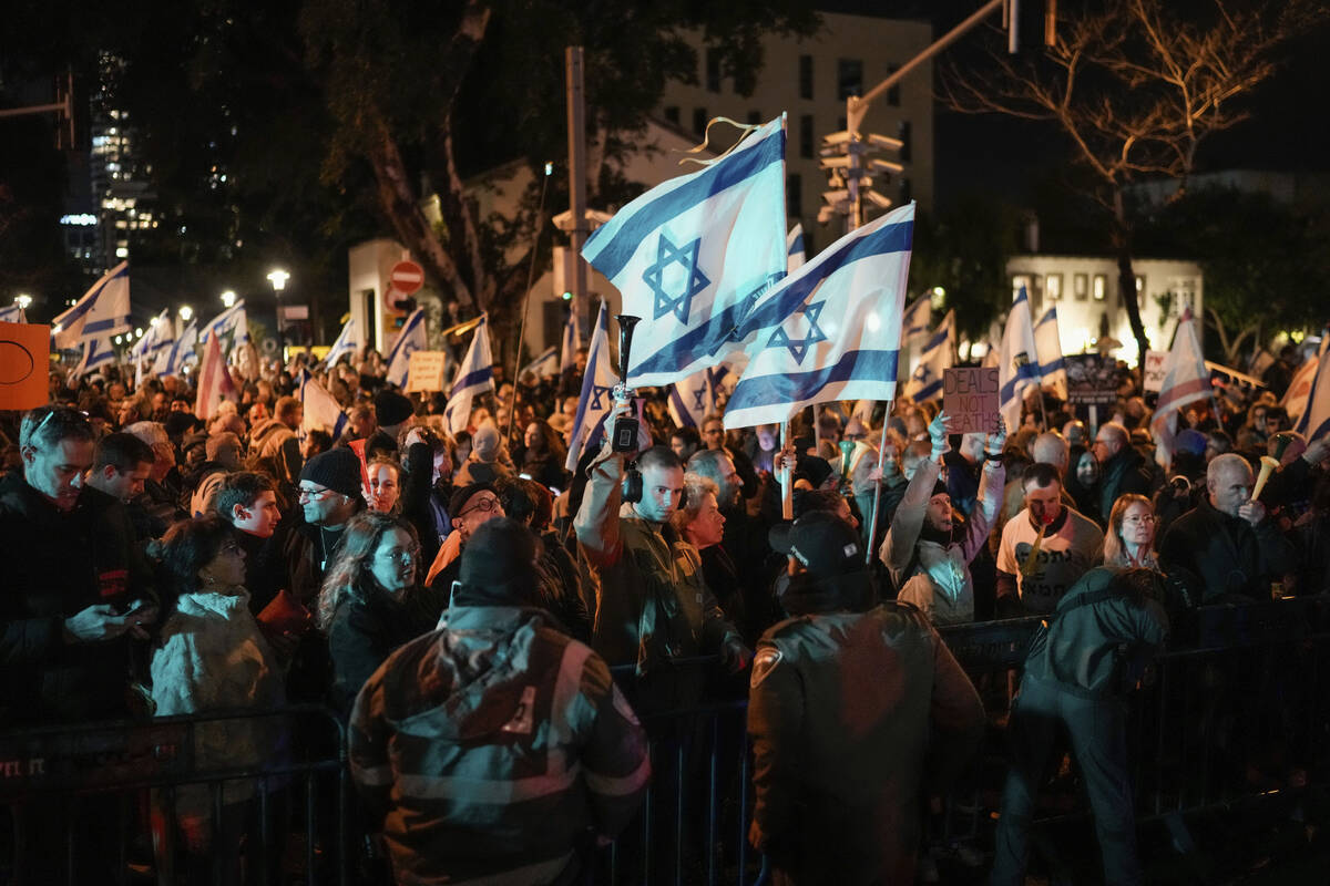 Demonstrators protest against Israeli Prime Minister Benjamin Netanyahu and call for new electi ...