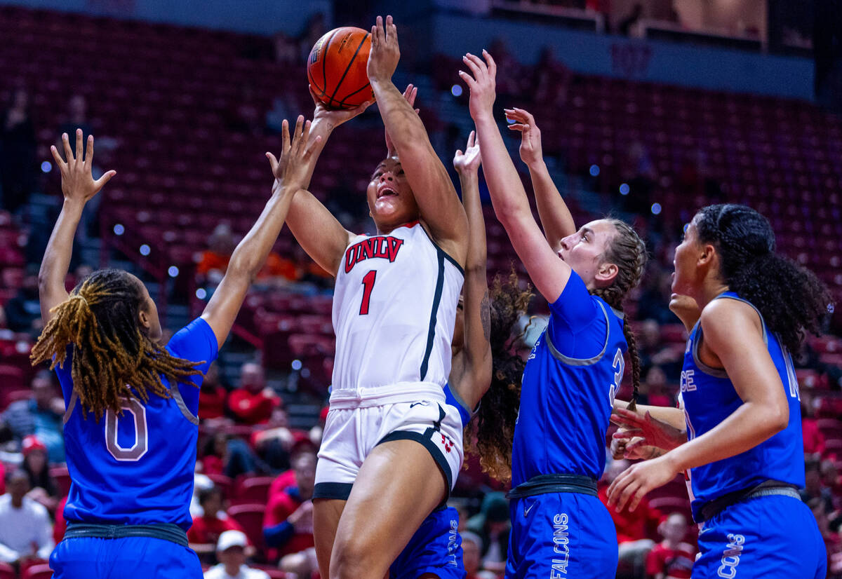 UNLV Lady Rebels forward Nneka Obiazor (1) battles to get off a shot with Air Force Falcons gua ...