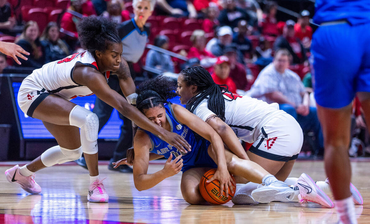 Air Force Falcons guard Jayda McNabb (10) takes a shot to the face by UNLV Lady Rebels center D ...