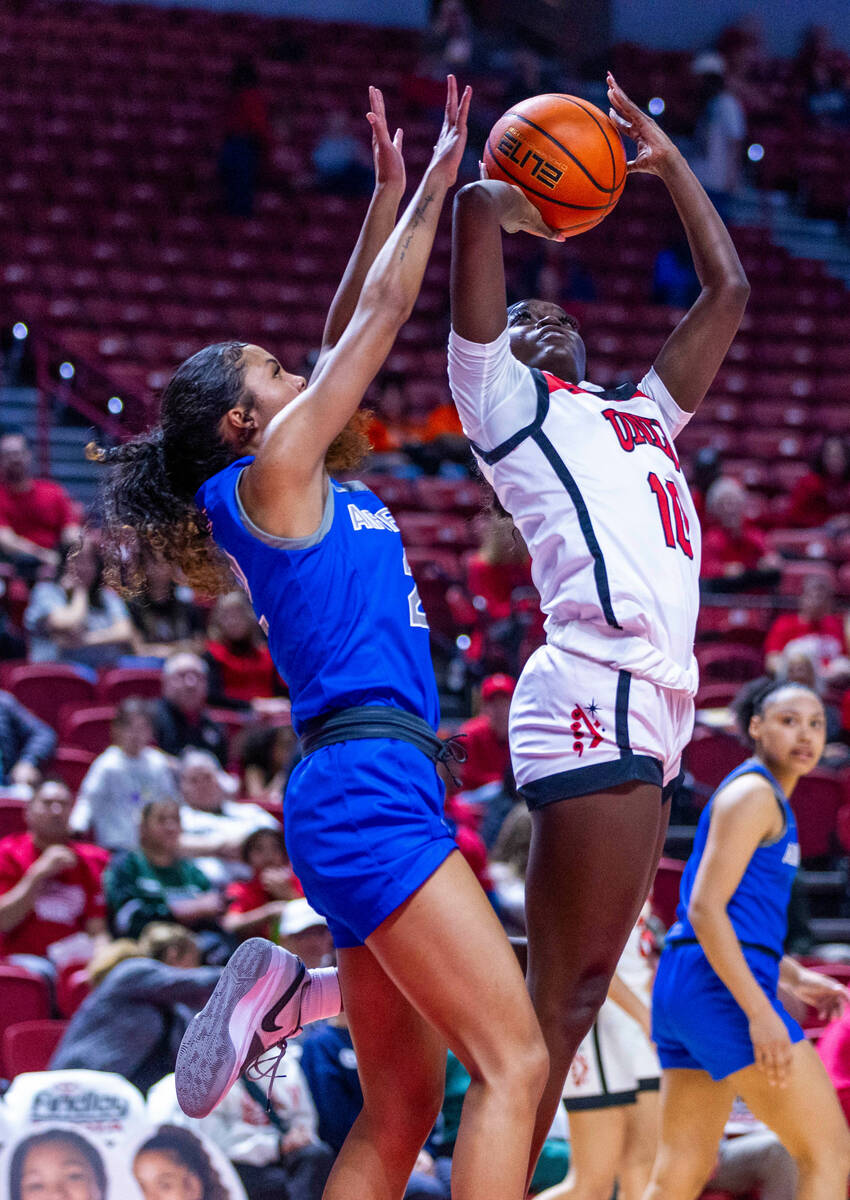 UNLV Lady Rebels guard Jasmyn Lott (10) posts up for a shot attempt with Air Force Falcons guar ...