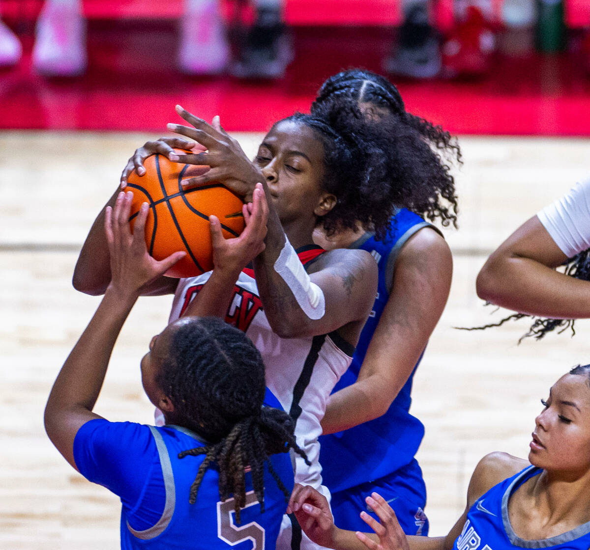 UNLV Lady Rebels center Desi-Rae Young (23) for loose ball with Air Force Falcons guard Taylor ...
