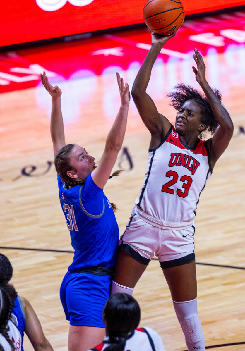 UNLV Lady Rebels center Desi-Rae Young (23) looks to shoot over Air Force Falcons forward Emily ...
