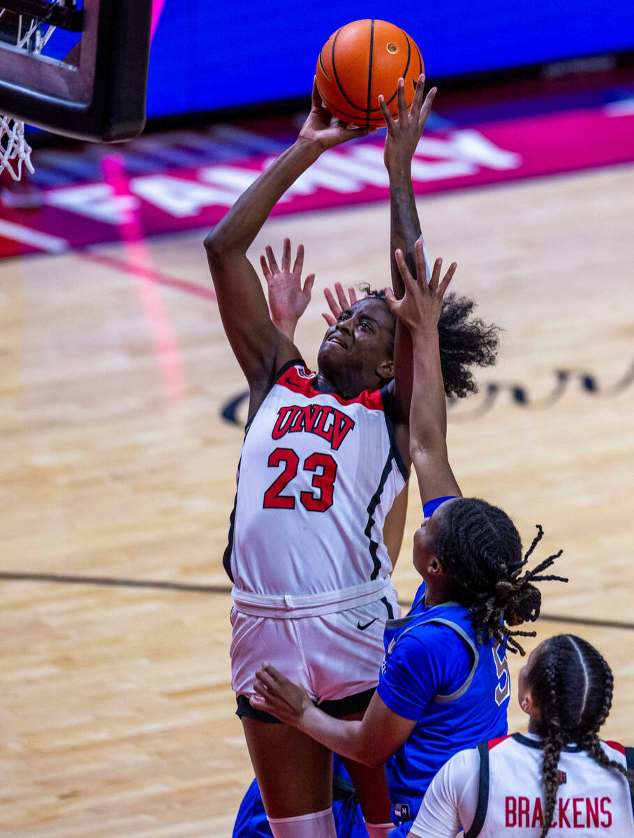 UNLV Lady Rebels center Desi-Rae Young (23) elevates for a shot over Air Force Falcons guard Ta ...